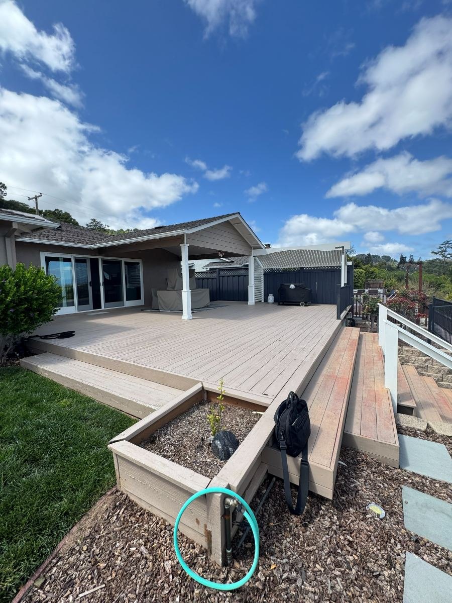 Raised composite deck with steps and planter boxes